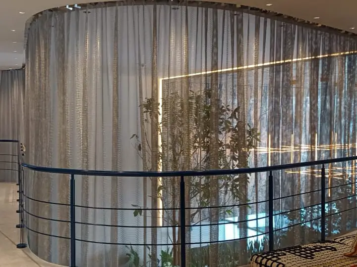 Decorative chainmail curtains installed on the exterior of the staircase