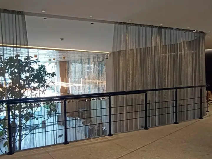 Chainmail curtains serving as decorative sunshades with aesthetic appeal