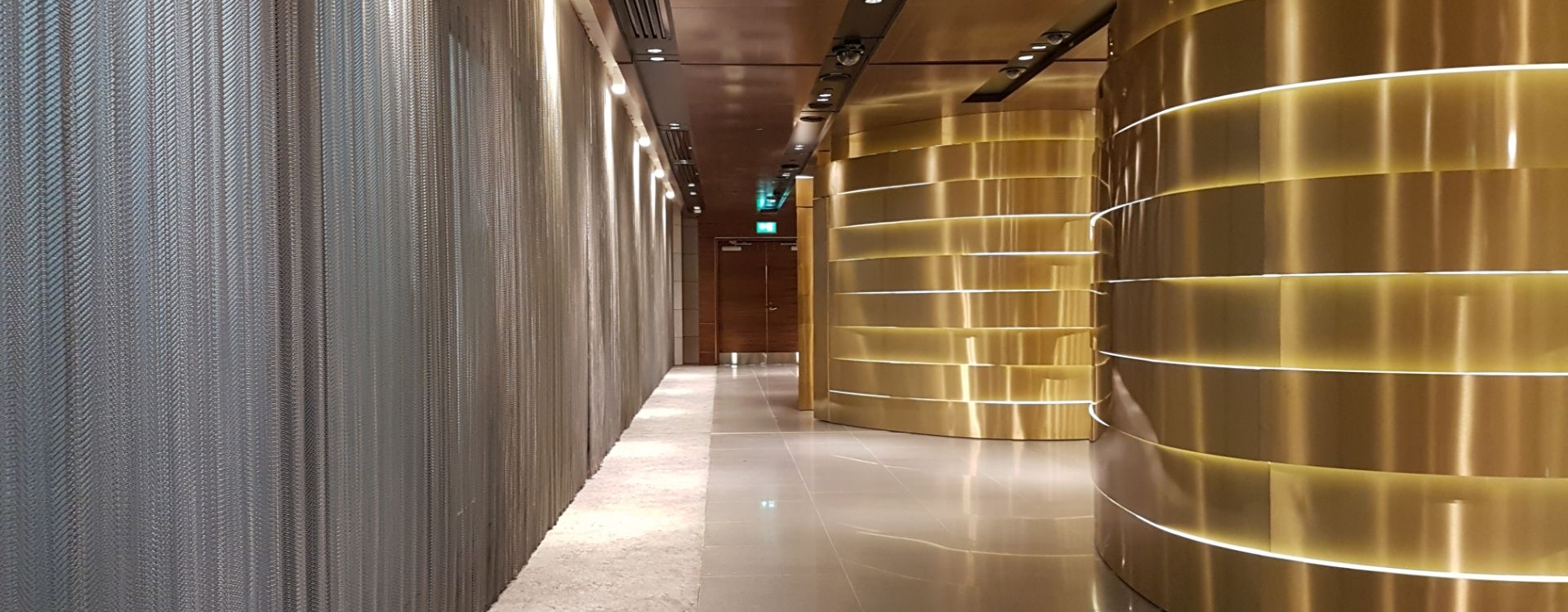 Silver decorative metal curtain is used to decorate the hotel wall.