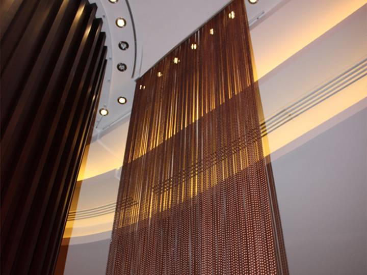 Brown metal bead chain installed at restaurant partition in Dubai, UAE