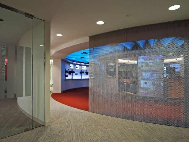 Metal bead curtain is used as office space divider.