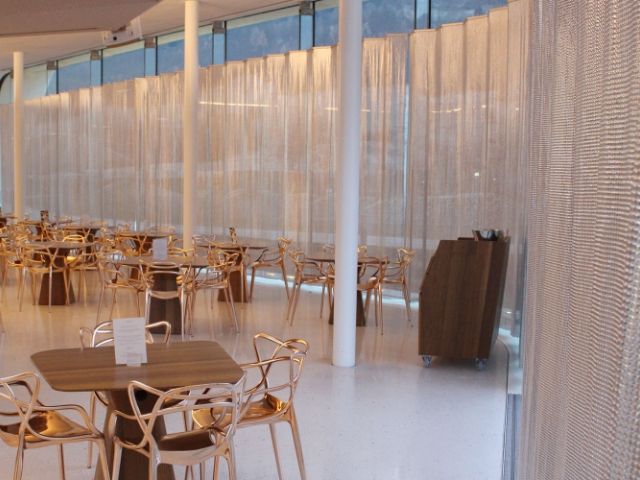 The restaurant is decorated with a metallic fabric cloth curtain.