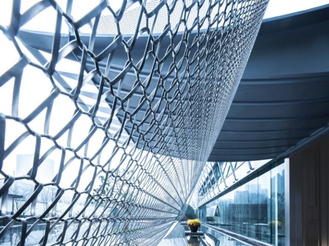 Spiral architectural mesh is used as outdoor facade.